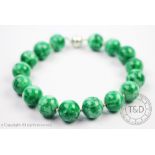 A large green agate bead necklace, designed as sixteen beads (each 2.