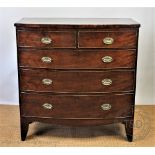 A late George III mahogany bow front chest, of two short and three graduated long drawers,