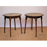 A pair of Arts and Crafts style oak occasional tables, early 20th century, with circular tops,