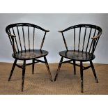 A pair of Ercol tub chairs, with solid seats, on tapered legs, 76cm H,