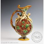 A Minton Majolica ewer, date code for 1860, the earthenware moon-flask shaped body in grey,