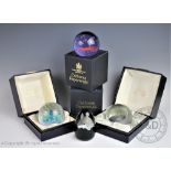 Three cased Caithness paperweights comprising; Limited Edition Arctic Night, No.