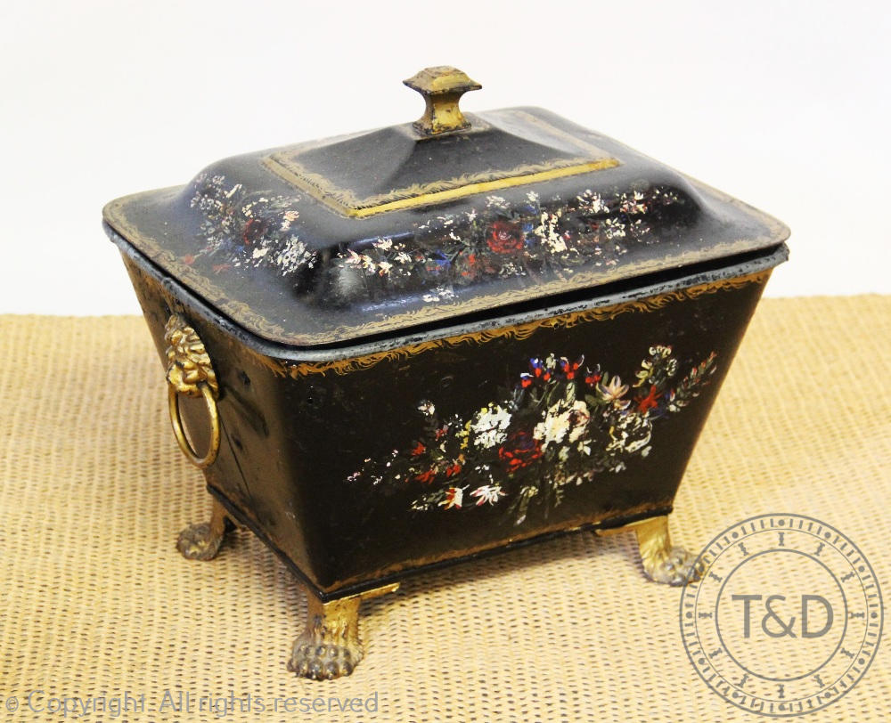 A Regency style toleware coal bin and cover, on paw feet,