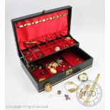 A jewellery box containing a collection of jewellery and watches,