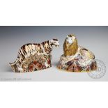 Two Royal Crown Derby paperweights comprising; a lion, with gold coloured stopper,