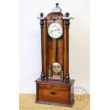 A walnut and stained beech Vienna regulator style twin weight wall clock,