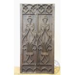 A 19th century carved oak panel, worked with angular foliate detailing,