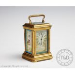A 19th century French porcelain set carriage time piece of small proportions,
