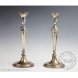 A pair of 800 standard silver candlesticks,