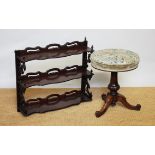 A Victorian carved walnut adjustable piano stool with a carved mahogany hanging shelf (2)