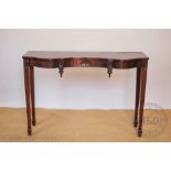 A reproduction mahogany serpentine hall table, 74cm H x 107cm W x 35cm D,