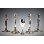 A pair of Adam style candlesticks, on oval bases,