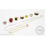 A collection of rings, to include; two garnet set 9ct yellow gold rings,