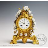 A 19th century French Louis XV style ormolu mantel clock,