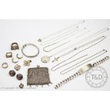 A collection of silver and silver coloured jewellery, to include; an identity bracelet,