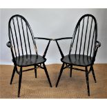 A set of four Ercol Quaker pattern dining chairs, all with arms,