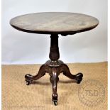 A 19th century oak centre table, with circular tile top,