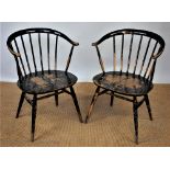 A pair of Ercol tub chairs, with solid seats, on tapered legs, 76cm H,