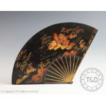 A Japanese lacquered fan shaped box and cover,