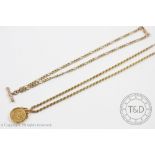 A £1 coin within 9ct gold mount and attached 9ct gold rope twist chain, chain weight 5.