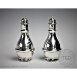 A pair of George V silver pepper pots, Peter Henderson Deere, London 1912, each of baluster form,