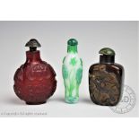 Three Chinese Peking glass snuff bottles comprising;