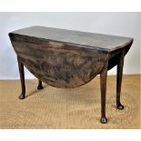 A George III and later mahogany gate leg table, on tapered legs with pad feet,