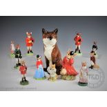 A collection of twelve novelty model foxes to include, a Beswick seated fox, 31cm high,