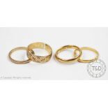 Two 22ct yellow gold wedding bands,