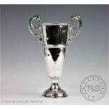 An Edwardian silver trophy, Martin Hall & Co, Sheffield 1904, with flying scroll handles,