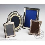 Four assorted silver and silver plate mounted photograph frames,