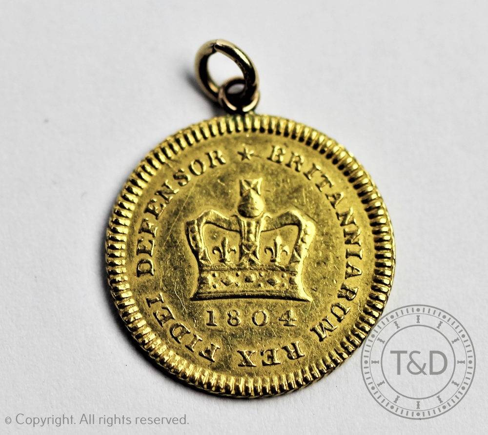 A George III gold quarter Guinea 1804,