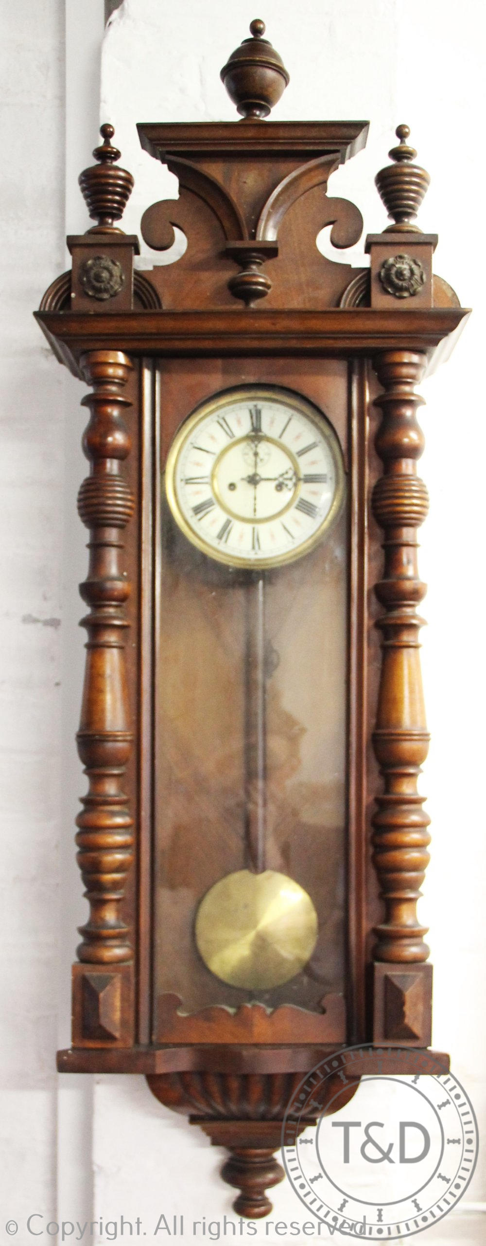 A walnut and beech Vienna regulator wall clock, Roman numeral dial with subsidiary seconds,