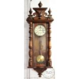 A walnut and beech Vienna regulator wall clock, Roman numeral dial with subsidiary seconds,