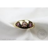 An Edwardian diamond and tourmaline set three stone ring, 'S B & S Ld' Birmingham 1908,