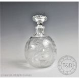 A Stevens and Williams glass decanter and stopper, the globular body cut with scrolling tendrils,