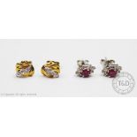 A pair of ruby and diamond set stud earrings,