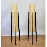 A pair of 1960's floor standing lamps, of tall slender form, with cylindrical shades,