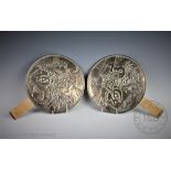 A pair of polished Japanese hand mirrors,