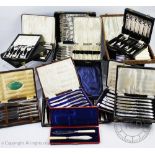 Four cased sets of six silver handled knives,