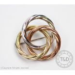 A tri-colour 9ct gold brooch, designed as three entwined circles in white, yellow and rose gold,