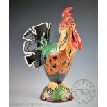 A Jennie Hale sculpture of a rooster, modelled standing and glazed in polychromes,
