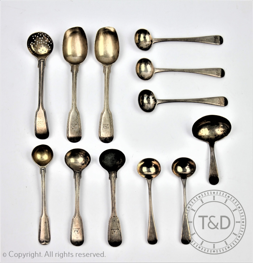 A selection of George III and later silver flatware to include a pair of caddy spoons,