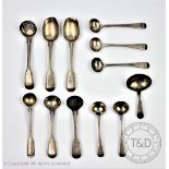 A selection of George III and later silver flatware to include a pair of caddy spoons,