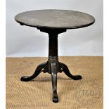 An early 19th century mahogany circular occasional table, on tripod base,