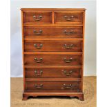 A modern walnut chest, of two short and five long drawers, on bracket feet,