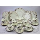 A Tuscan China tea service comprising; ten teacups and saucers, ten cake plates,