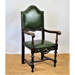 A 17th century style carved oak carver chair, early 20th century,with green rexine upholster,