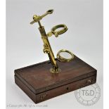 An early 19th century lacquered brass field microscope,
