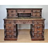 A Victorian carved oak desk,